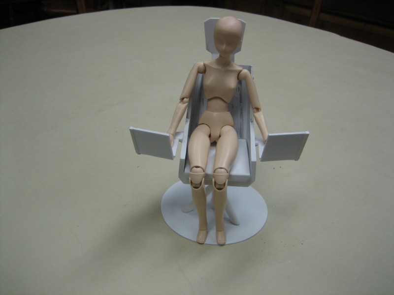 Blue command chair, with doll simulating Ekaril